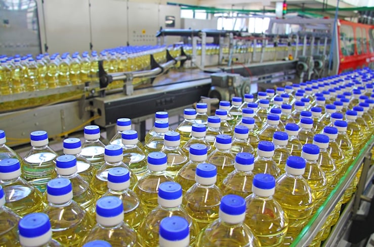 food manufacuting bottles on conveyor