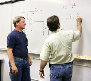 Instructor and Student at Whiteboard