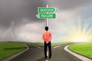 Businessman choosing success or failure road